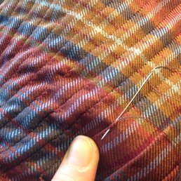 Hand stitching the pleats - Crimson Kilts